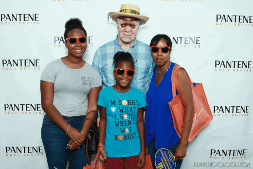 Tianna, her grandparents, and her younger cousin Sydney at the Black Family Reunion which is usually held downtown
